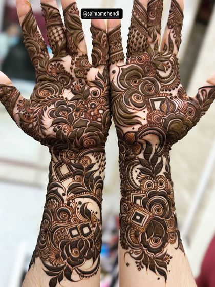 This design is a perfect example of a fusion style, blending traditional Indian motifs with the bold, flowing lines of Arabic patterns.