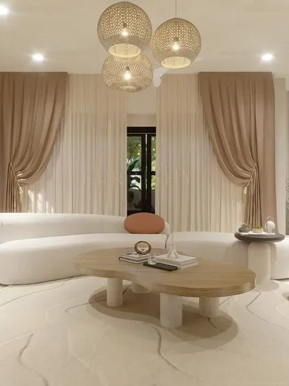 A 3D visualization of a living space for a 6000 sq ft villa in Banjara Hills, Hyderabad. The design focuses on creating warmth and luxury through extensive drapery, a statement rug, and soft, curved furniture.