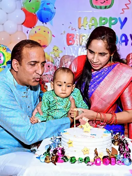 A precious moment as a family celebrates their baby's first birthday with a Cocomelon-themed cake. We help make these first milestones extra special.
