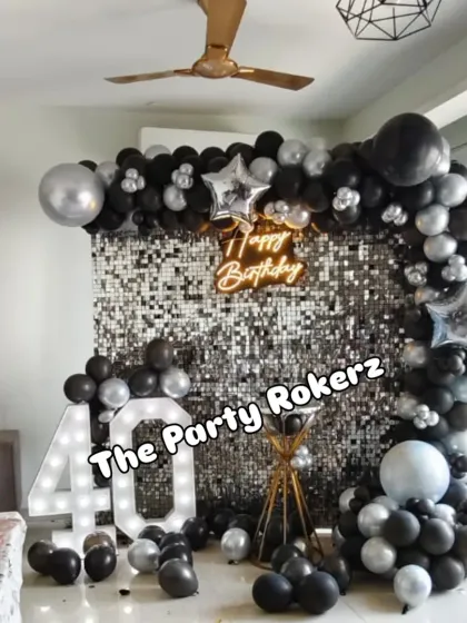 A wider shot of the 40th birthday decor in a home setting, showing how our setup can transform a living room into a chic party space.