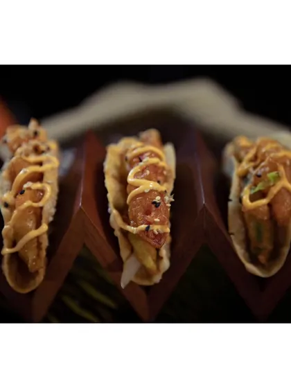 Another look at the delicious Korean Avocado Tacos, highlighting the crispy texture of the avocado and the creamy sauce.