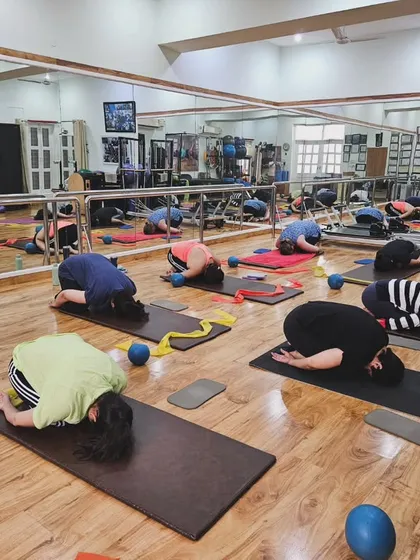 Taking a moment to rest and reset during a Gyrokinesis mat class. This practice focuses on gentle, fluid movements that start from the spine and work outwards, connecting breath and movement without the use of machines.