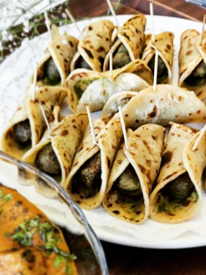 Our mini frankies are an all-time favorite. These small wraps are filled with a savory vegetable and potato mixture, secured with a toothpick for easy handling at parties.