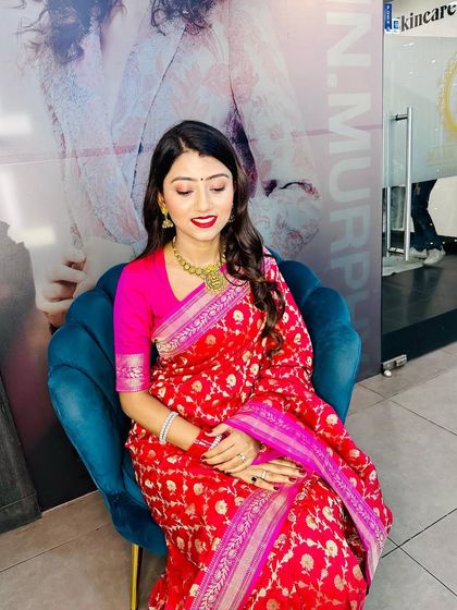 Another shot of this beautiful client, showing how the makeup looks with her eyes down, emphasizing the clean eyeliner and soft gold jewelry.