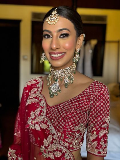 A smiling portrait of Ria. Her happiness is the centerpiece of the look, enhanced by my signature natural makeup style.