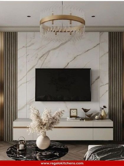 An opulent design featuring a marble-clad wall with fluted side panels and gold accents. The floating white console adds a clean, modern touch to the luxurious setup.