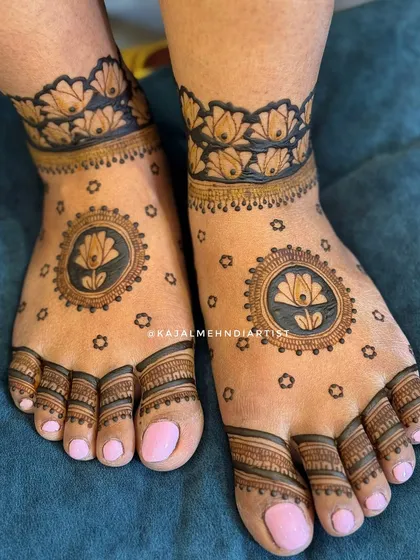 A minimal bridal leg design with lotus mandalas.