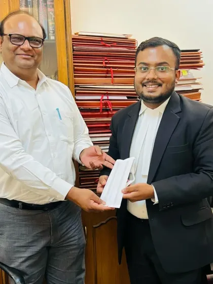 Another senior member of the legal community celebrating with our new advocate. The strength of our firm lies in the collective experience and collaborative spirit of our team.