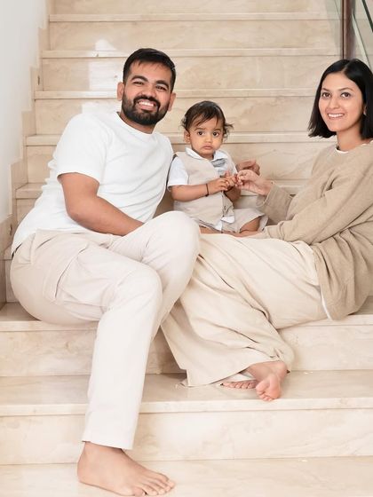 A relaxed family portrait on the stairs at home. Using your own space makes the photos feel incredibly personal and unique to your story.