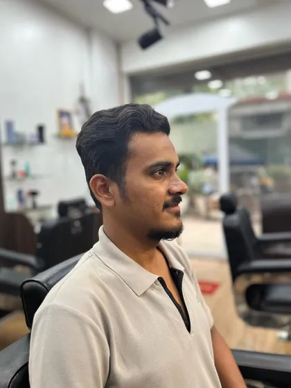 The side profile of a low fade cut, showcasing the clean line-up and subtle transition.