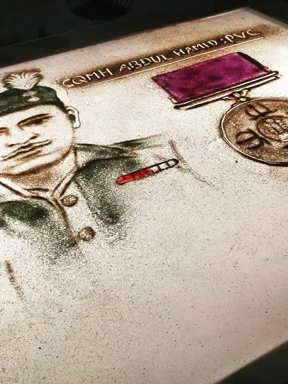 A frame from our recent short film on the Battle of Asal Uttar, featuring a sand portrait of the brave CQMH Abdul Hamid, PVC. It is an honour to immortalize our heroes in sand.
