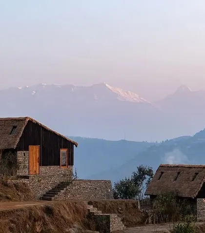 Our work in the Himalayas involves creating architecture that respects the scale and spirit of the mountains. These guesthouses in Panchachuli are built with local stone and topped with traditional thatch roofs, designed to offer serene refuge with staggering views of the snow-capped peaks.