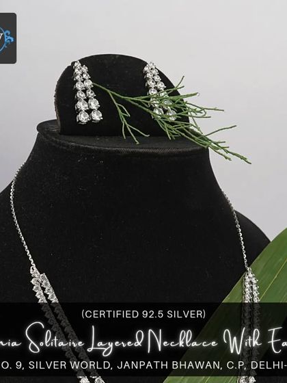 Another angle of the layered zirconia solitaire necklace set, showing how the earrings complement the necklace's design for a cohesive and elegant look.