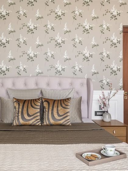 Another view of the Parsi-inspired grandmother's room. The floral wallpaper, tufted headboard, and vintage-style lamp create a cohesive and charming space that honors heritage while feeling fresh.