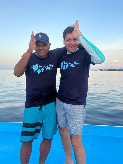 Making the thresher shark sign after a successful dive in Malapascua. It's a tradition.