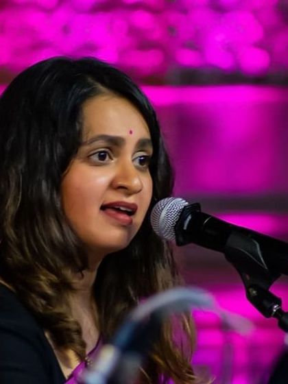 A performance at the Bengaluru Ganesha Utsava, with the stage bathed in beautiful pink light. The atmosphere of these large public concerts is always so vibrant and celebratory.