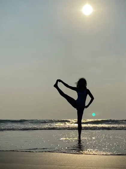 Would you like me to plan my next yoga retreat in a tropical paradise? A balancing pose against a sunset beach backdrop is always an inspiration.