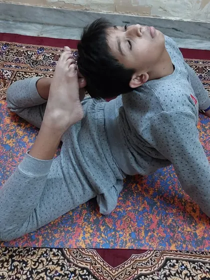 My young student in Eka Pada Rajakapotasana (One-Legged King Pigeon Pose), an advanced backbend that removes stiffness from the neck, shoulders, and chest.