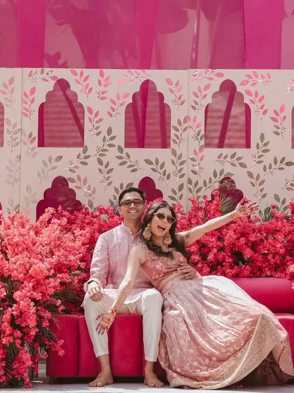 Pre-wedding events should be full of color and joy. For this Mehendi, I designed a vibrant pink floral backdrop with a modern arch pattern, creating the perfect fun and photogenic spot for the couple.