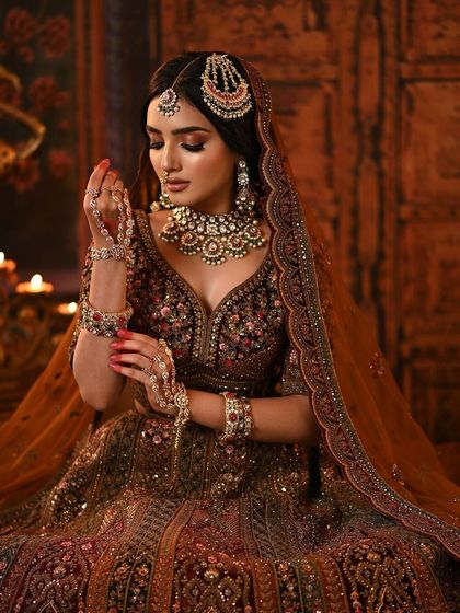 A beautiful portrait showing the full effect of the heavy embroidery and the dramatic makeup.