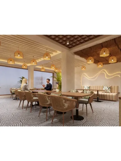 A wide view of the bohemian-style cafe, showing the spacious layout, ample natural light, and consistent use of natural materials.