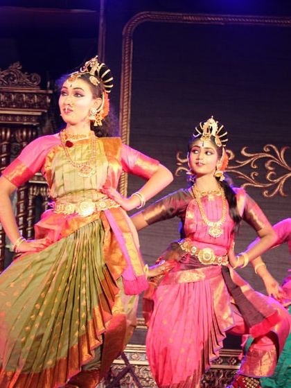 Three of our dancers in a graceful pose during the "Nava Durga" show. Their elegant postures and coordinated movements are a highlight of the performance.