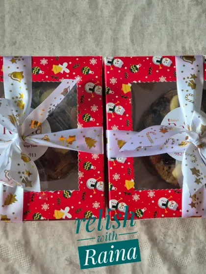My Christmas cakes make for a wonderful gift. Here are two of my smaller cakes packed in festive red boxes with a window, tied with a beautiful ribbon.