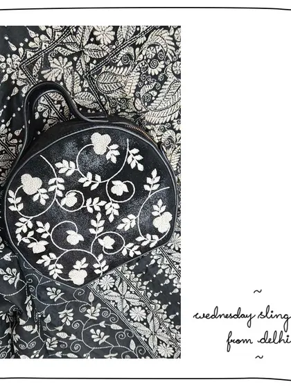 Art on art. Our patron Meghana created this beautiful flat-lay of her Wednesday Sling in our Lace Galaxy edit. The white embroidery on the black metallic leather looks stunning against the similarly patterned fabric.