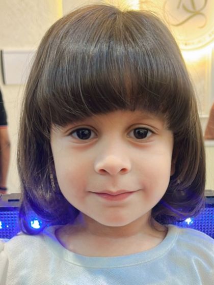 An adorable baby's haircut. This cute bob with a full fringe is absolutely precious and perfectly styled for our little client.