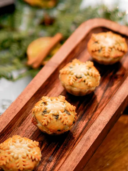 Our snowflake-topped mince pies are almost too pretty to eat. Each one is handcrafted with a buttery crust and a rich, festive filling, making them a perfect treat for Thanksgiving and Christmas.