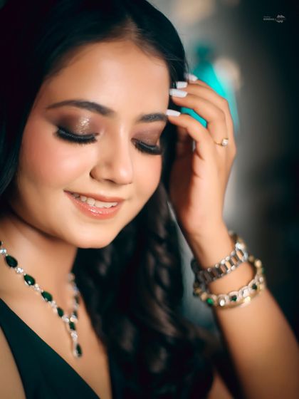 A close-up of the bride, highlighting her stunning eye makeup. This shot focuses on the details that complete the bridal look.