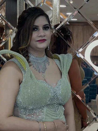 A closer look at the makeup for the silver gown. The dark, dramatic eyes are balanced with a subtle lip color, creating a high-fashion look.