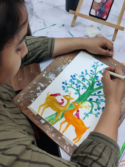 A collection of images from our Gond painting workshop, showing students engaged in the process and their beautiful finished pieces.