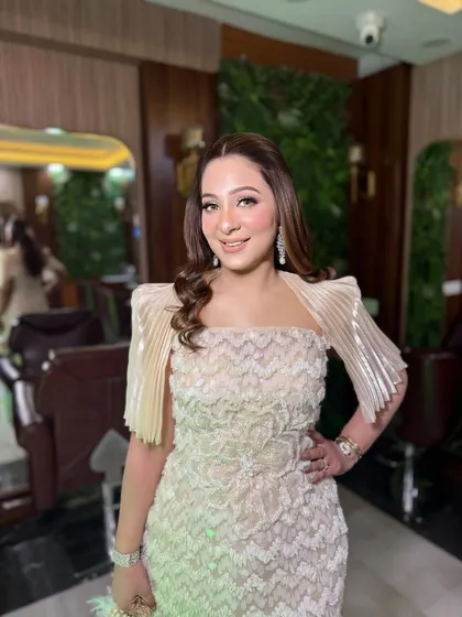 Her smile shows how confident and beautiful she feels. This soft glam look is all about enhancing natural beauty.