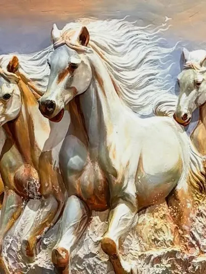 A close-up on the lead horses, showcasing the detailed sculpting of their faces and manes. This is a popular design for bringing good fortune and success.