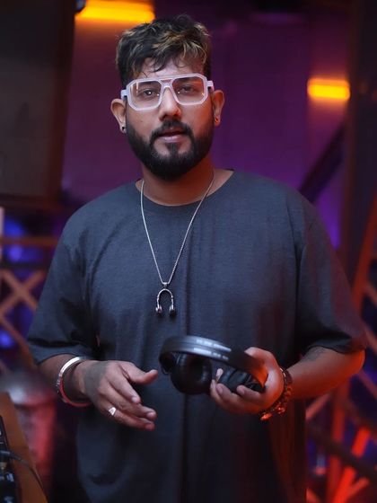 A duplicate of my confident look, holding my headphones.