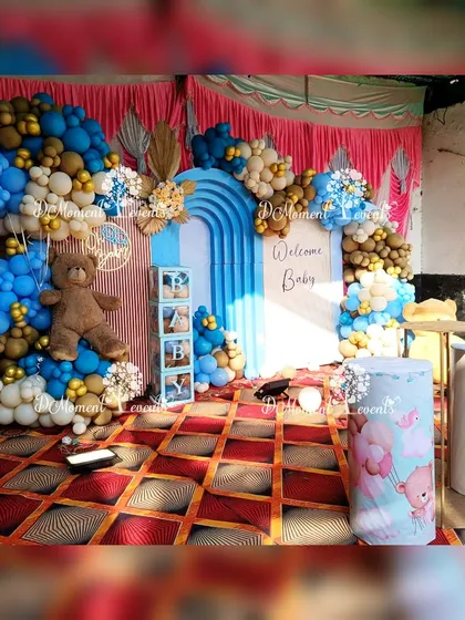 The main backdrop for the teddy bear themed baby welcome party. The setup includes modern arched panels, "BABY" blocks, and cute teddy bear props.