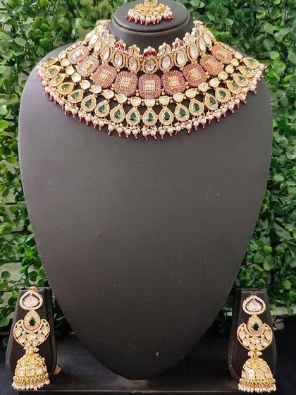 A lovely pastel-toned kundan set with pink and green accents, perfect for a daytime wedding.