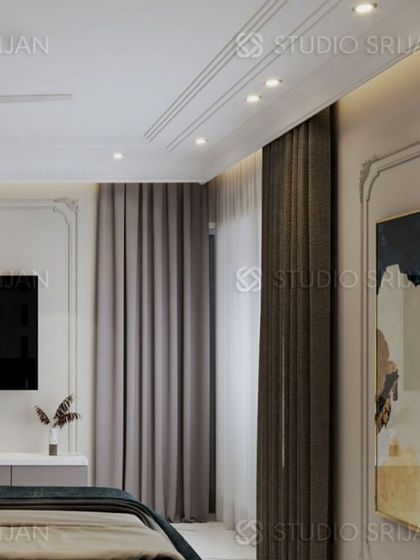 A detail shot of the TV wall and curtains, highlighting the classic wall molding and the clean, simple lines of the furniture.