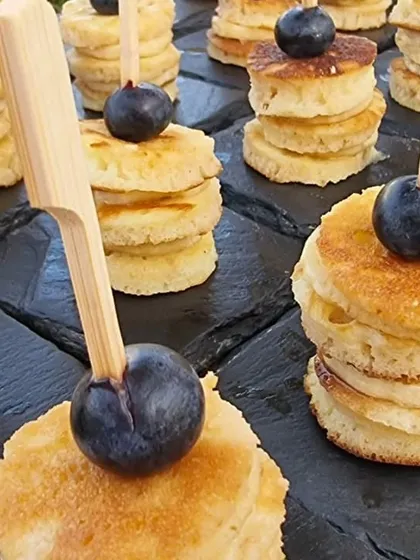 Mini pancake stacks topped with fresh blueberries. This is one of our most popular items for kids' parties, offering a touch of indulgence that both kids and adults love.