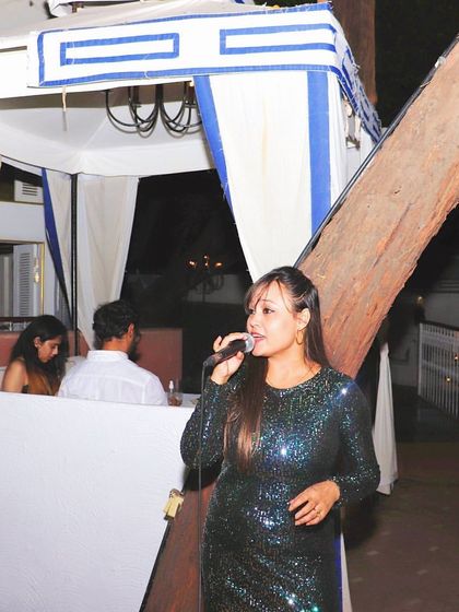 We often have live music to enhance the atmosphere. Here, a talented singer entertains guests, adding a special touch to the evening.