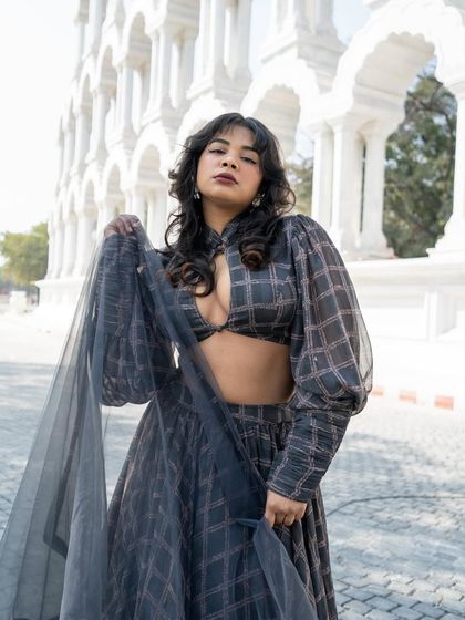 Who said wearing Indian can't be fun and playful? This grey printed Indo-western lehenga is fashion-forward.