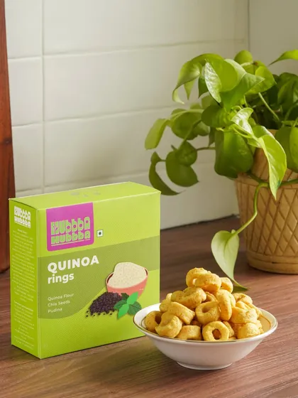 Healthy quinoa rings from Hubba Hubba Foods, styled with a potted plant to reinforce the product's natural and wholesome qualities.
