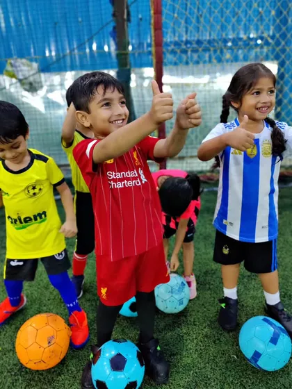 Thumbs up from our toddlers. Their happy faces show how much they enjoy our rainy day sessions.