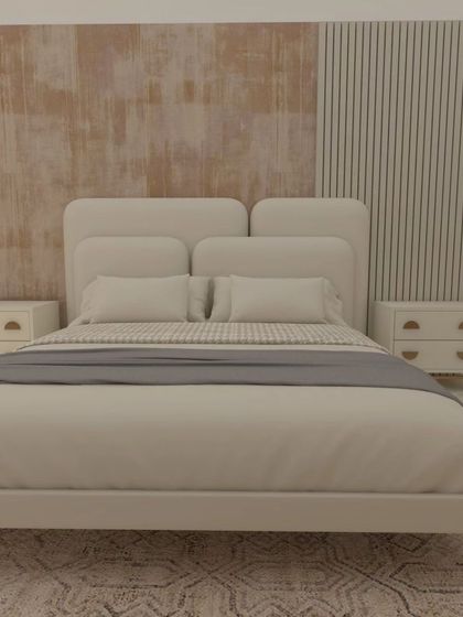 A full view of the master bedroom design for Cleo County, showing the upholstered bed against the textured accent wall. The bedside tables are simple and modern, keeping the focus on the beautiful wall treatment.