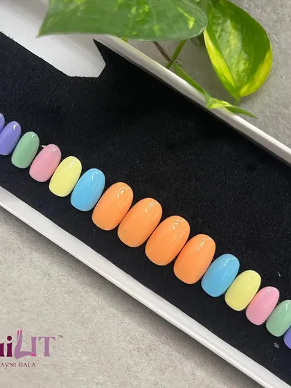 Pastely pastels. A full set of custom press-on nails in a rainbow of soft pastel colors, perfect for summer.
