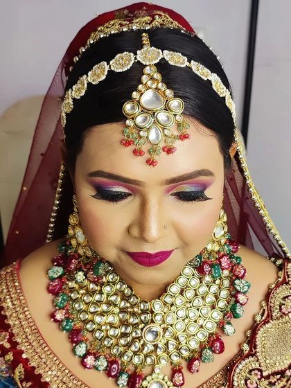 A detailed shot of the eye makeup for this bridal look. The combination of colors and sharp eyeliner creates a look that is both bold and beautiful.