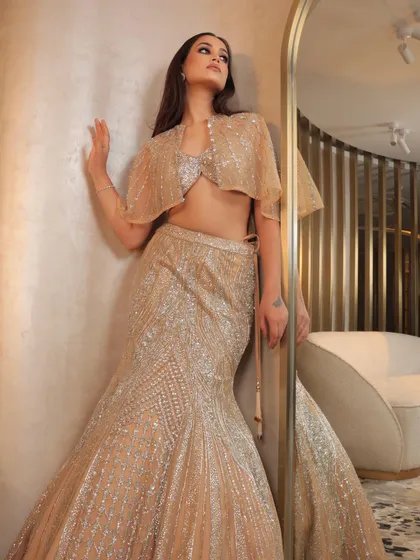 Another angle of the Sunlit Reef lehenga, showing how the light catches the intricate sequin and zari work. The makeup enhances her features without overpowering the outfit.