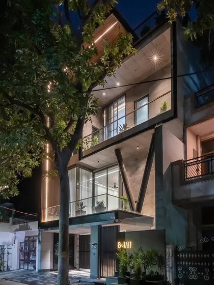 The completed Paschim Vihar project at night. We used integrated linear lighting and strategically placed spotlights to accentuate the architectural forms, including the distinctive V-shaped columns.