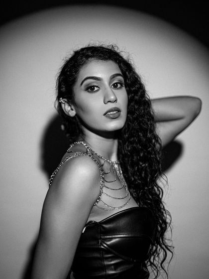 Another monochrome shot, where the contrast highlights the glowing skin and defined features.